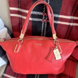 Melon colored, leather coach bag